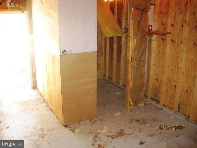 355 Rt 28 Berkeley Springs Berkeley Springs, WV 25411 - Photo 19 of 24 a view of a hallway with wooden walls