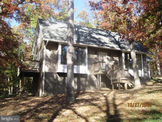 355 Rt 28 Berkeley Springs Berkeley Springs, WV 25411 - Photo 20 of 24 a view of a house with a yard