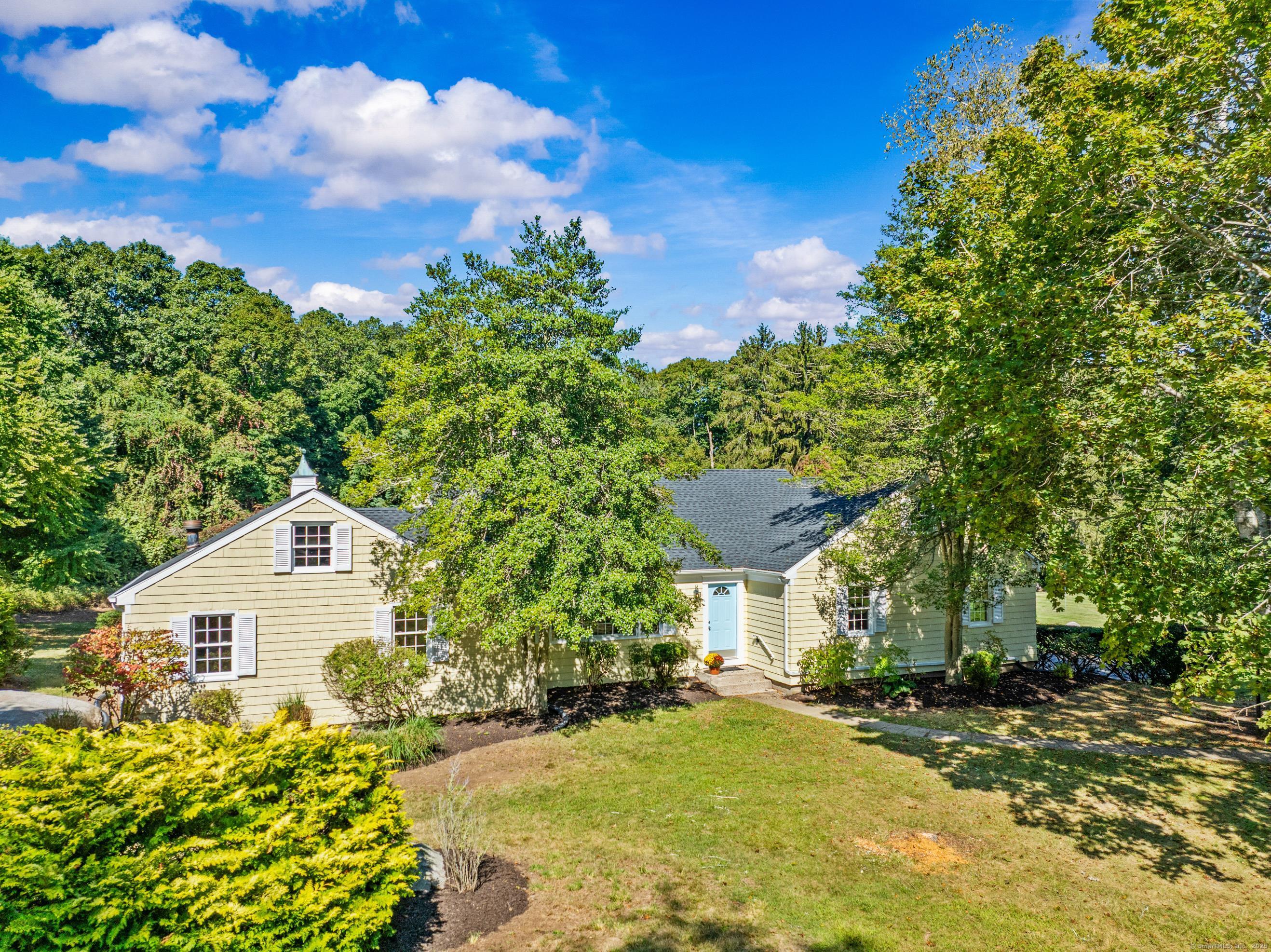 14 Horseshoe Lane Madison, CT 06443 - Photo 1 of 1 a front view of a house with a yard