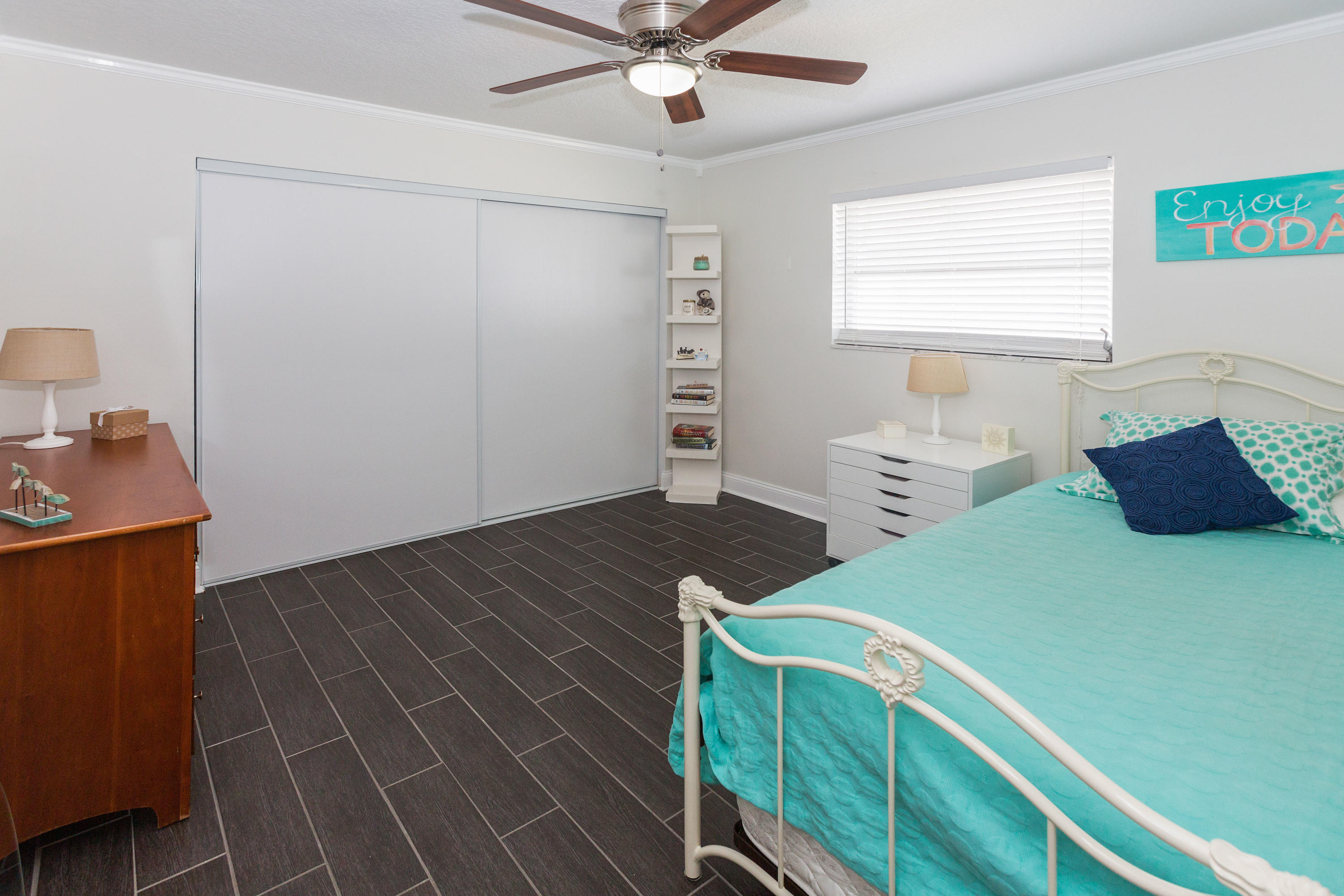 12705 Ellison Wilson Road North Palm Beach, FL 33408 - Photo 12 of 19 a bedroom with a bed and window