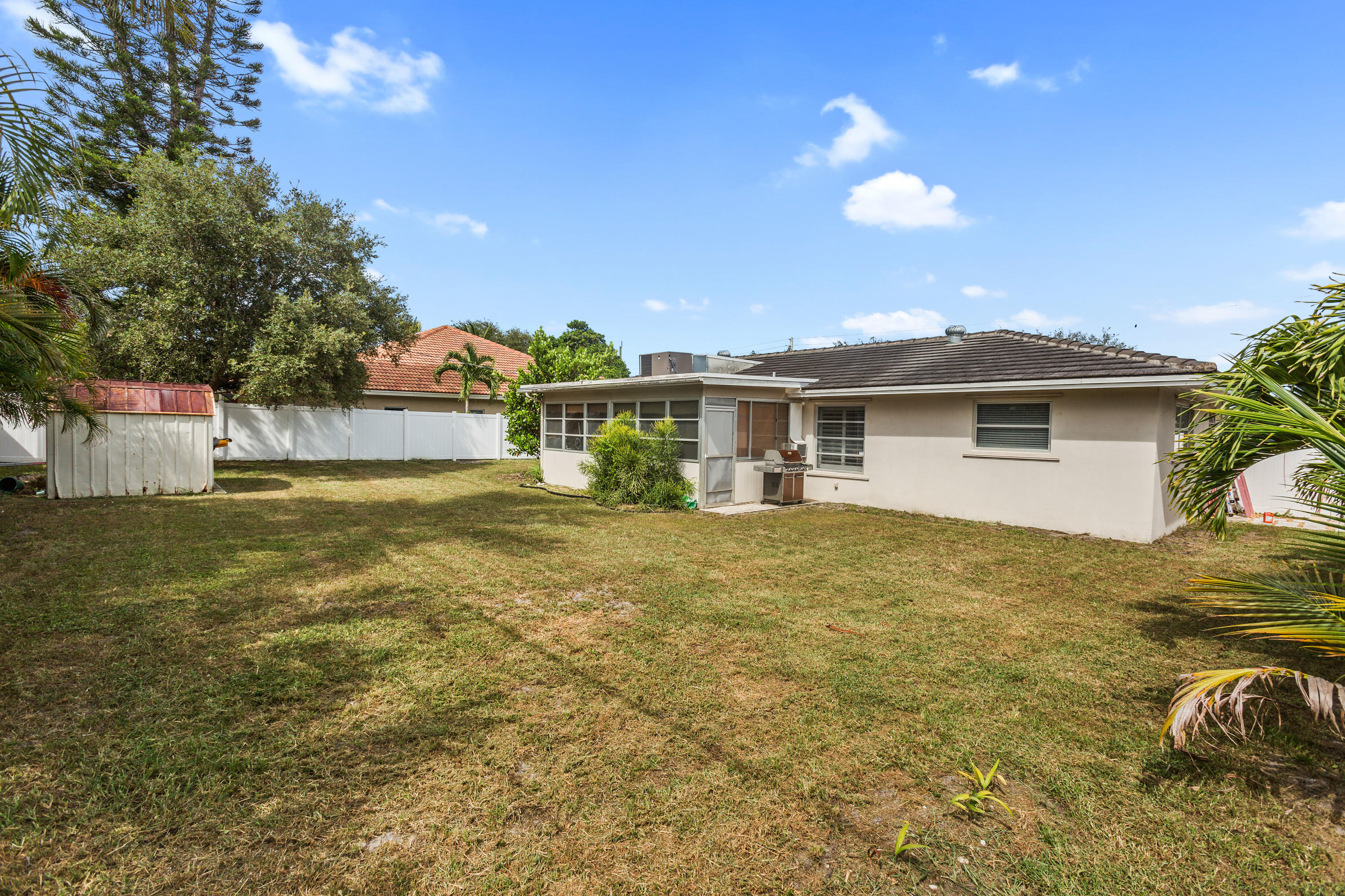 12705 Ellison Wilson Road North Palm Beach, FL 33408 - Photo 15 of 19 a view of a house with a backyard