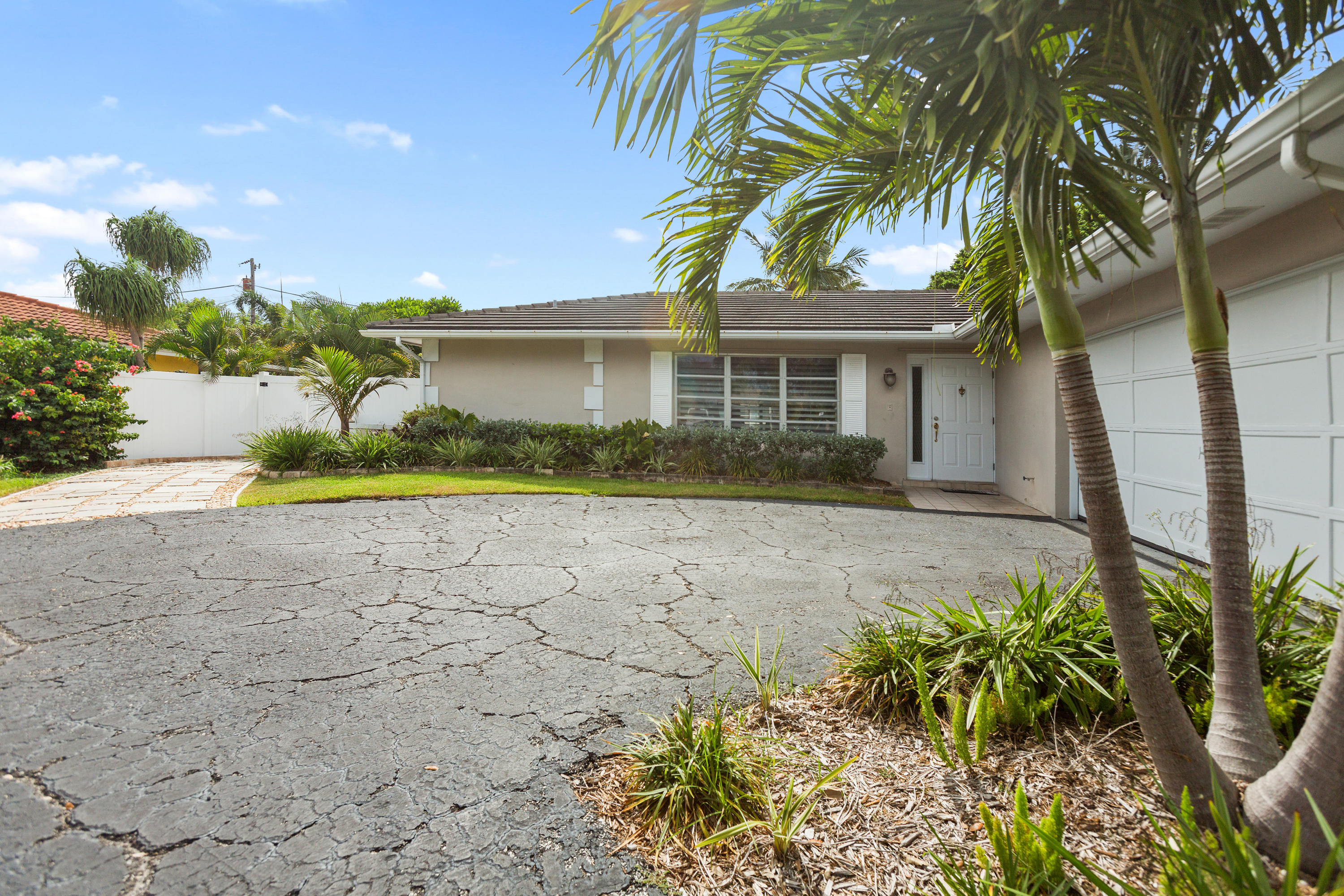 12705 Ellison Wilson Road North Palm Beach, FL 33408 - Photo 19 of 19 a front view of house with yard and green space