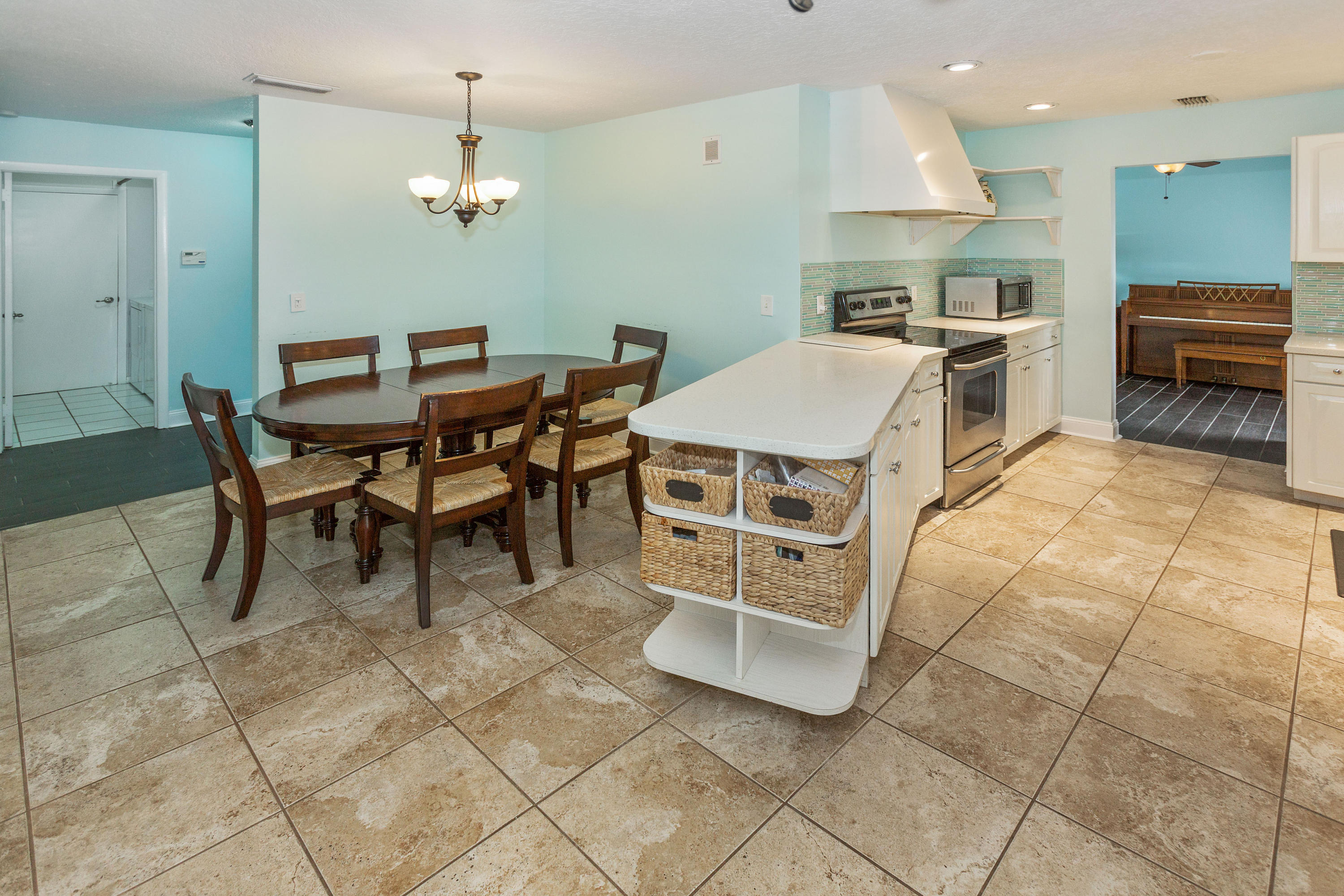12705 Ellison Wilson Road North Palm Beach, FL 33408 - Photo 5 of 19 a view of a dining room with furniture