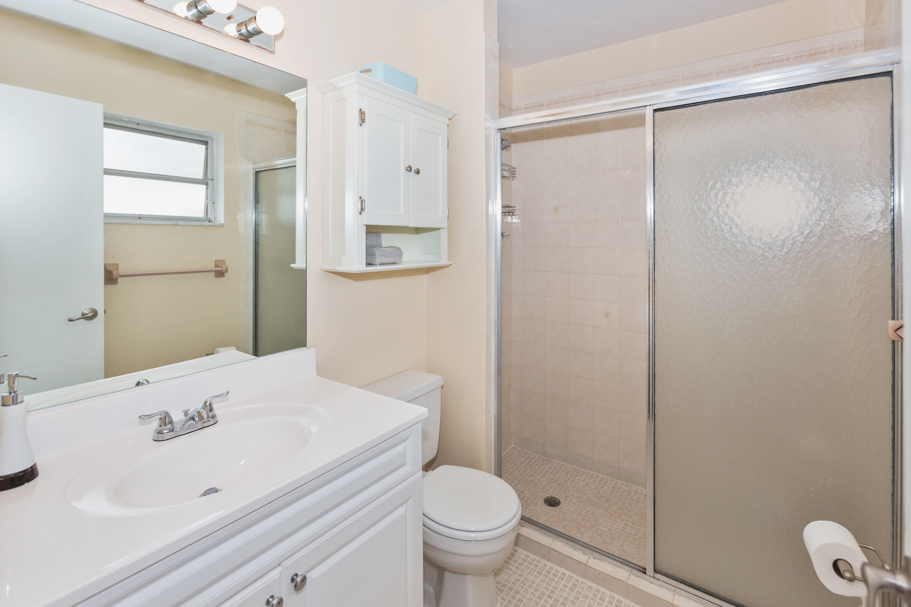 12705 Ellison Wilson Road North Palm Beach, FL 33408 - Photo 9 of 19 a bathroom with a sink and a mirror