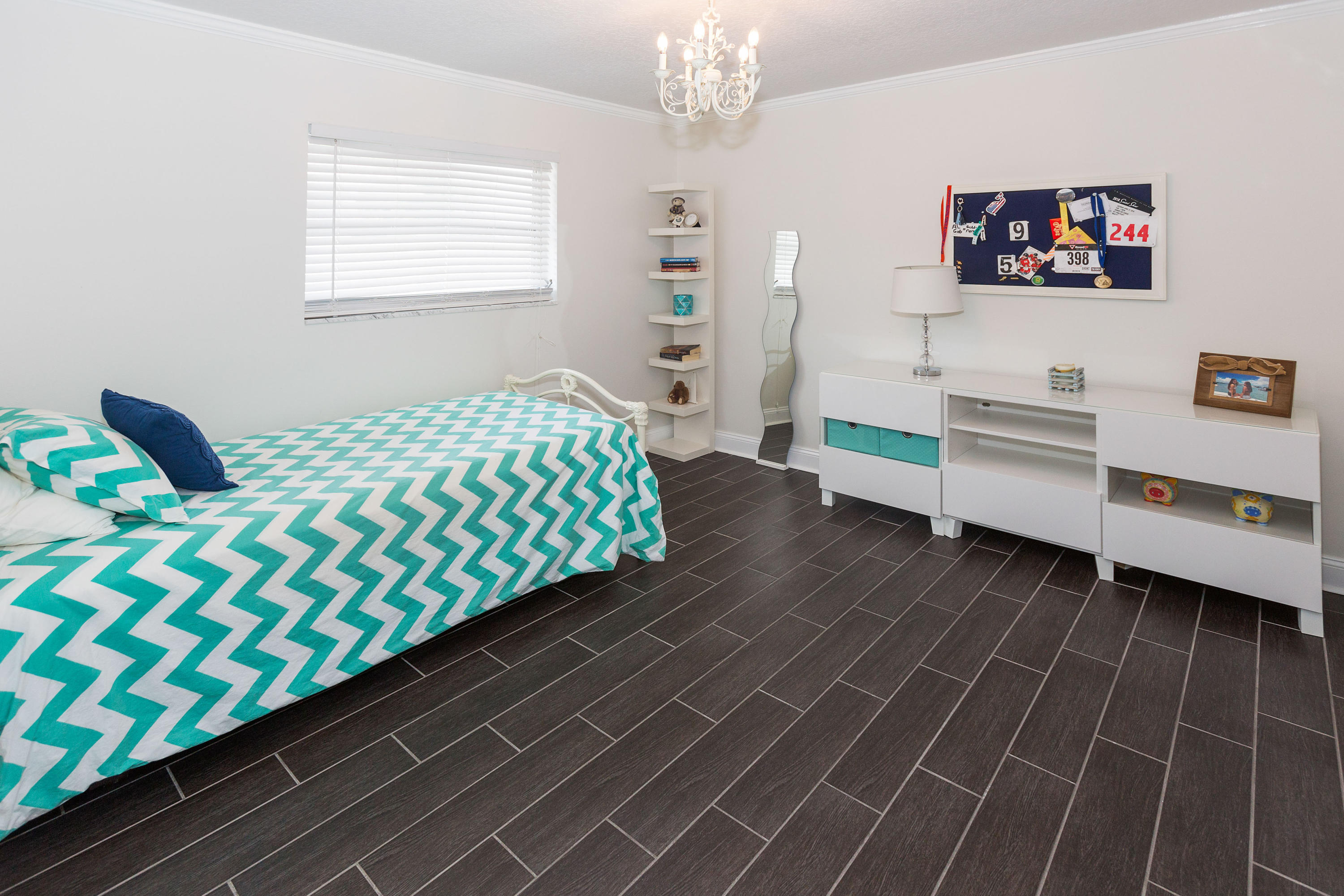 12705 Ellison Wilson Road North Palm Beach, FL 33408 - Photo 10 of 19 a bedroom with furniture and a baby crib