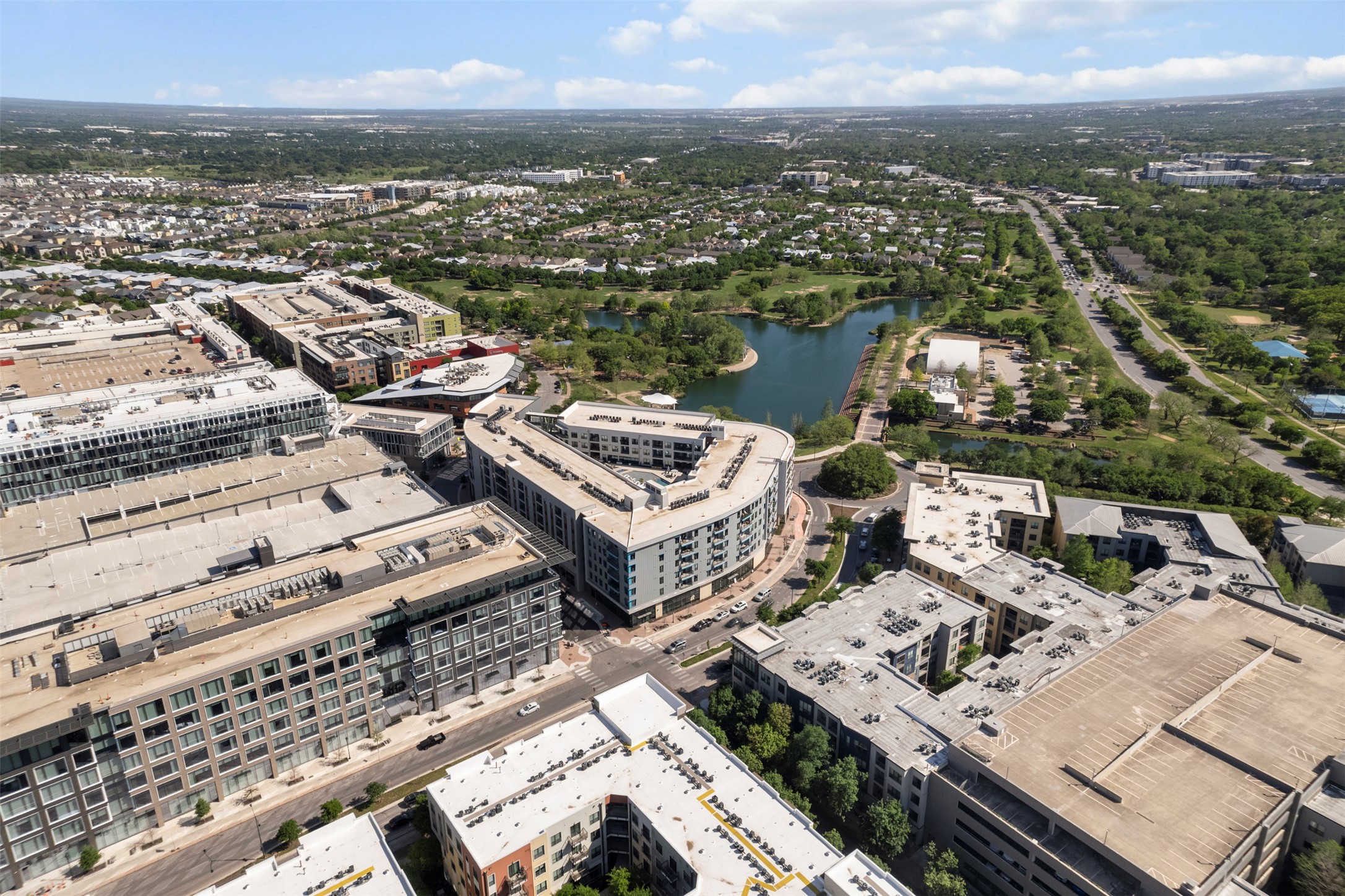 1701 Simond Avenue, Unit 418 Austin, TX 78723 - Photo 35 of 37 Aerial view featuring a water view.