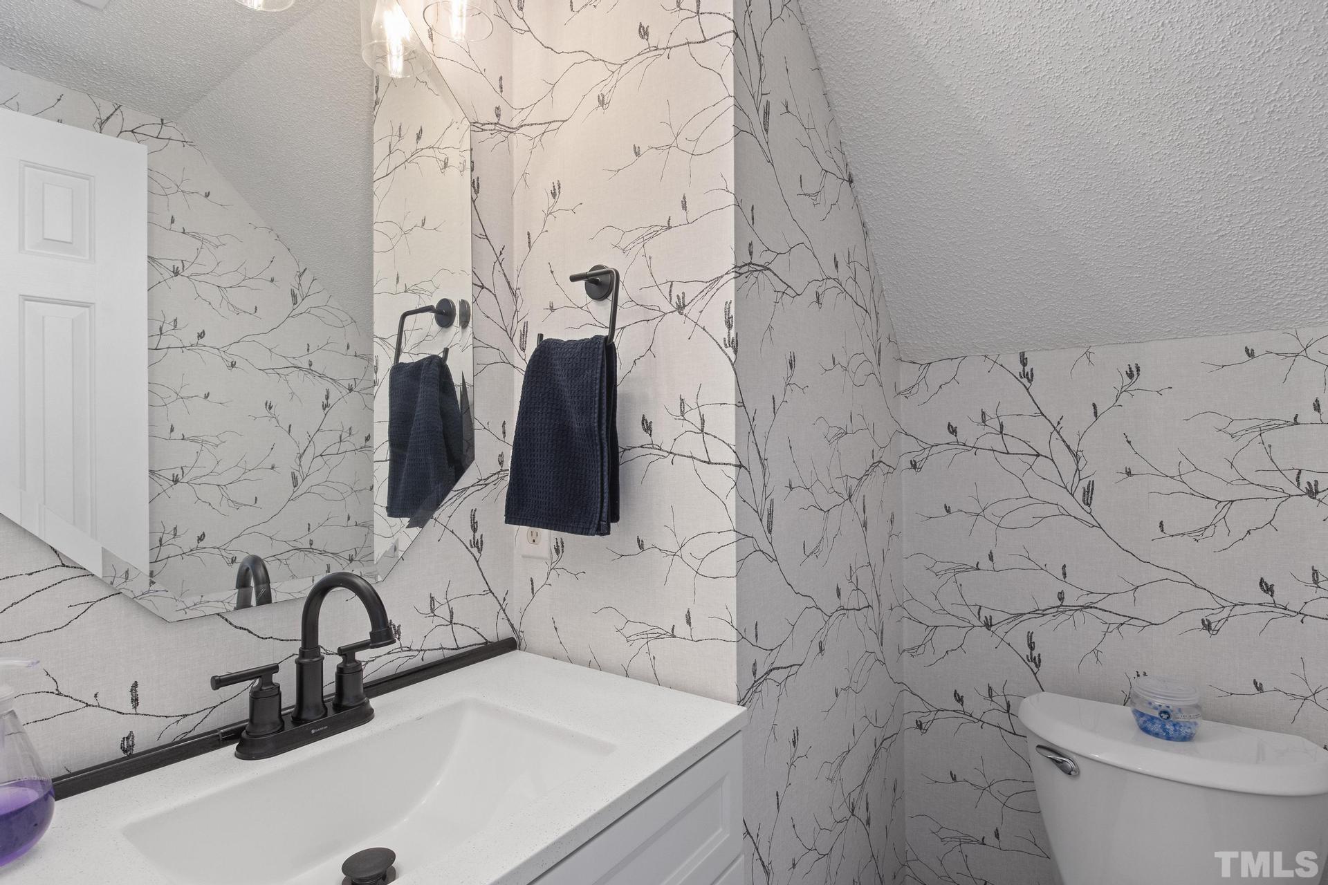 1727 Crag Burn Lane Raleigh, NC 27604 - Photo 14 of 43 a bathroom with a sink and a toilet