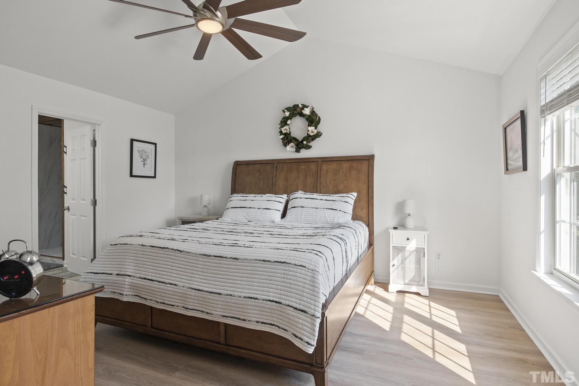 1727 Crag Burn Lane Raleigh, NC 27604 - Photo 16 of 43 a bedroom with a bed and window