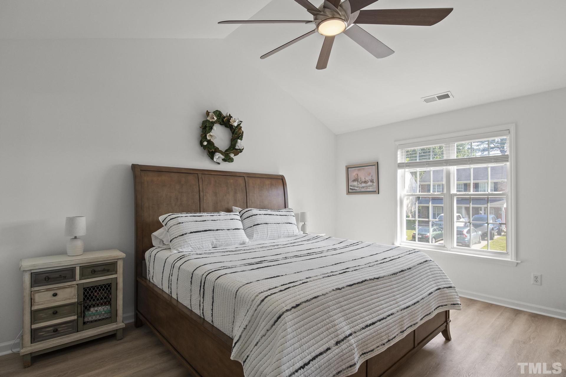 1727 Crag Burn Lane Raleigh, NC 27604 - Photo 18 of 43 a bedroom with a bed and a window