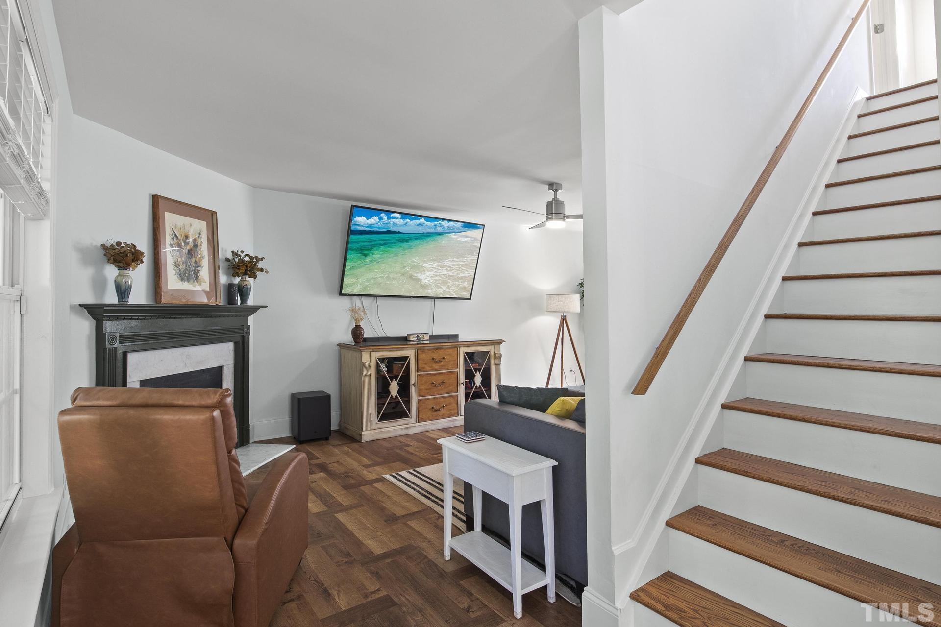 1727 Crag Burn Lane Raleigh, NC 27604 - Photo 2 of 43 a room with furniture and a flat screen tv
