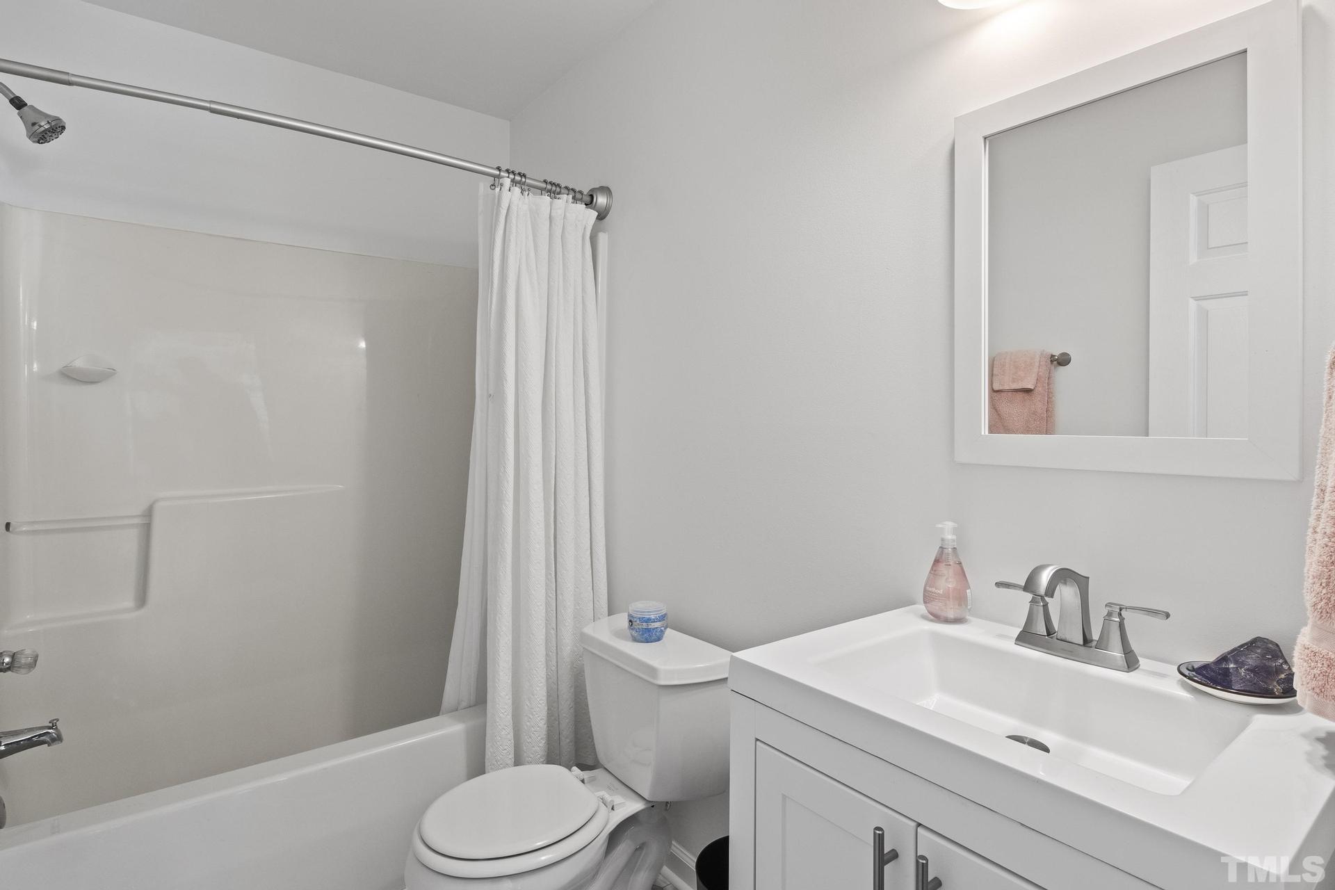 1727 Crag Burn Lane Raleigh, NC 27604 - Photo 26 of 43 a bathroom with a sink toilet and shower