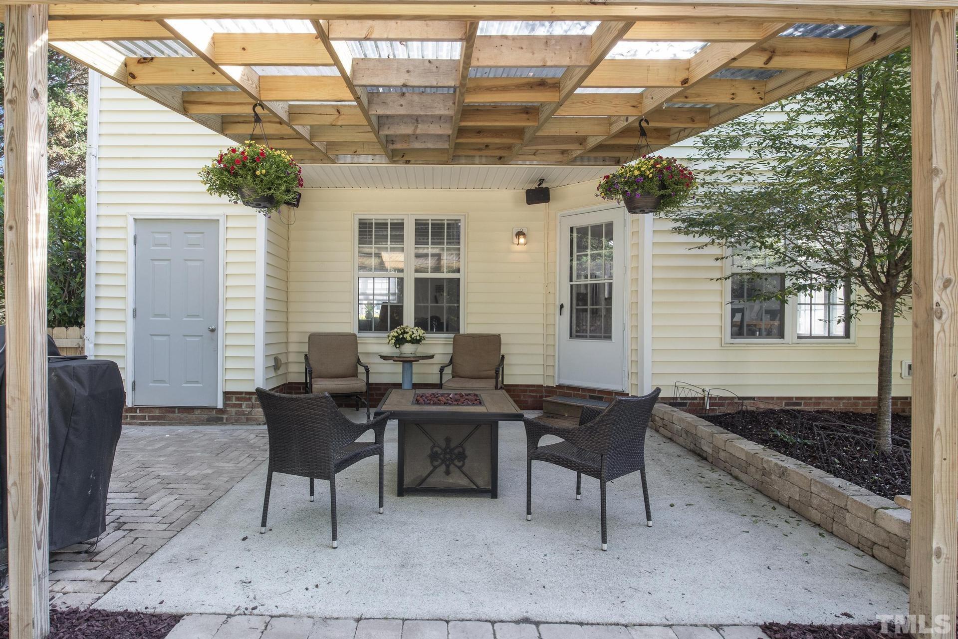 1727 Crag Burn Lane Raleigh, NC 27604 - Photo 28 of 43 a building outdoor space with patio furniture and potted plants