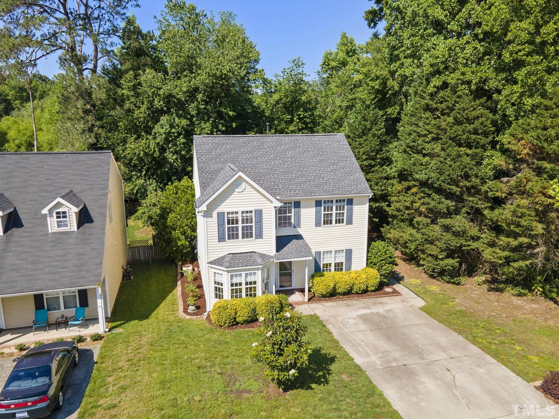 1727 Crag Burn Lane Raleigh, NC 27604 - Photo 37 of 43 a aerial view of a house with a yard table and chairs