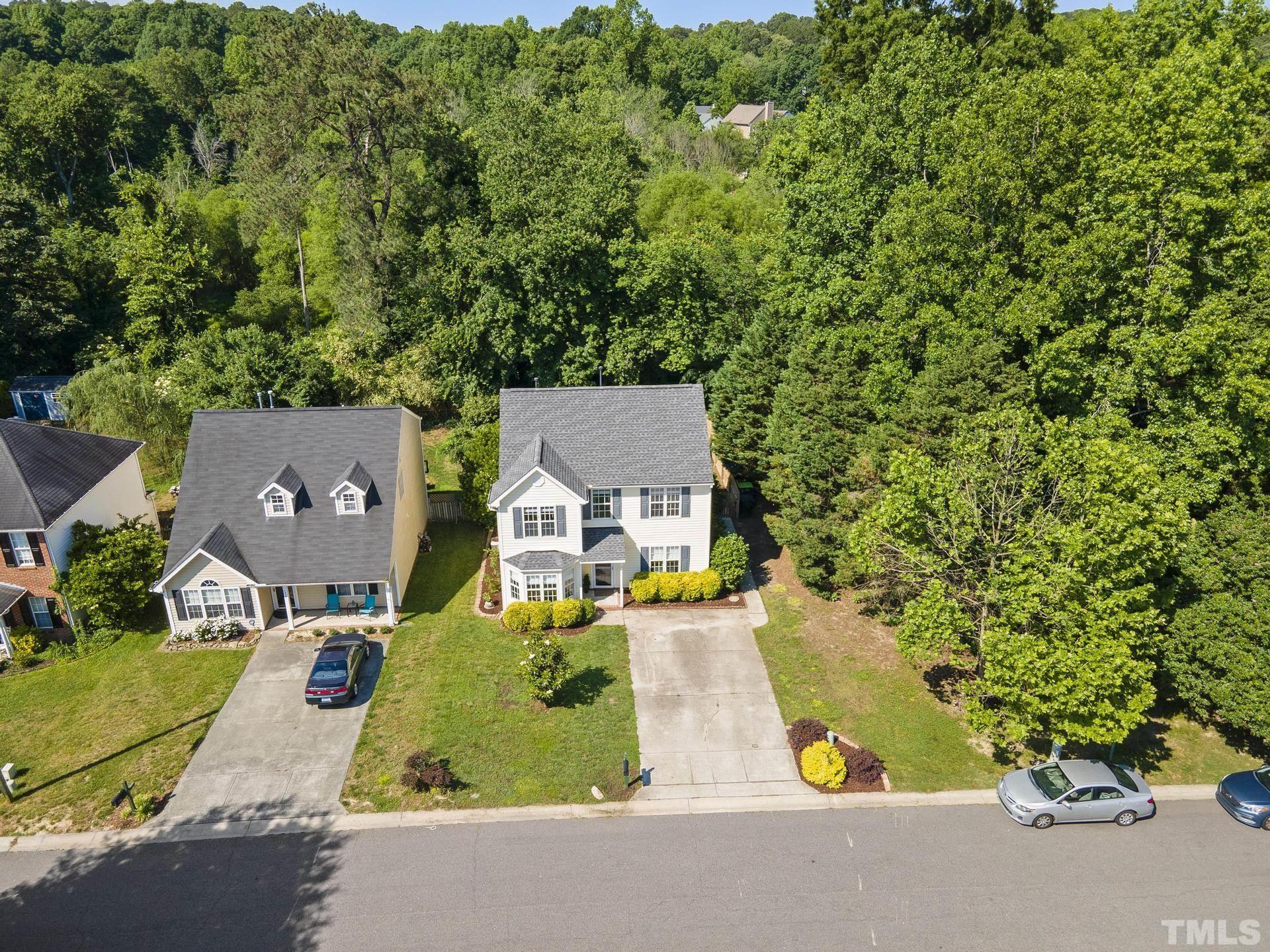 1727 Crag Burn Lane Raleigh, NC 27604 - Photo 38 of 43 an aerial view of a house with swimming pool and large trees