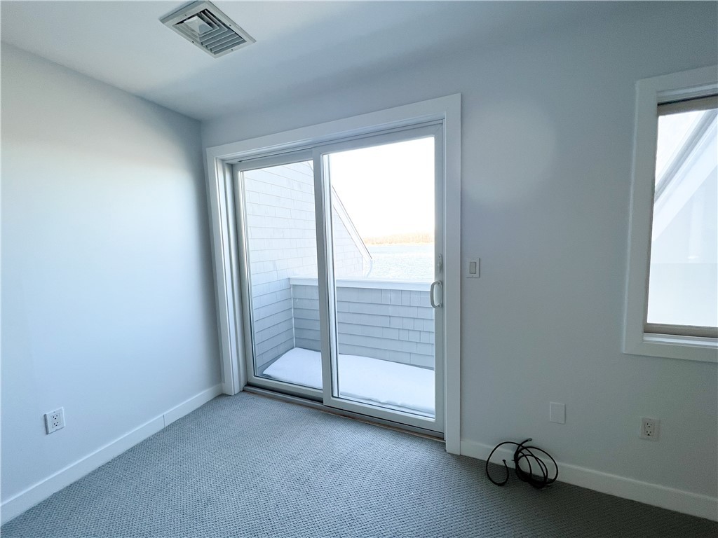 9 Poppasquash Road Bristol, RI 02809 - Photo 11 of 36 Sliding doors to balcony in primary bedroom