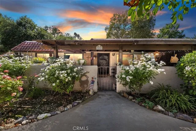 an outdoor view of house and yard with green space