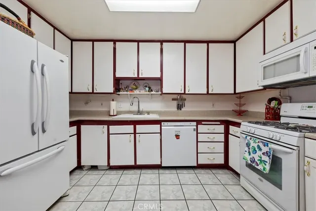 a bathroom with a toilet a sink and a mirror