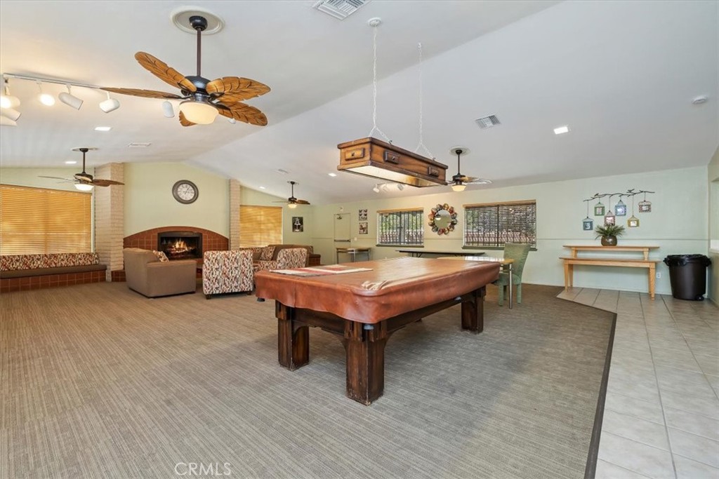 2850 Monroe Street Riverside, CA 92504 - Photo 21 of 23 a living room with furniture a rug and a ceiling fan