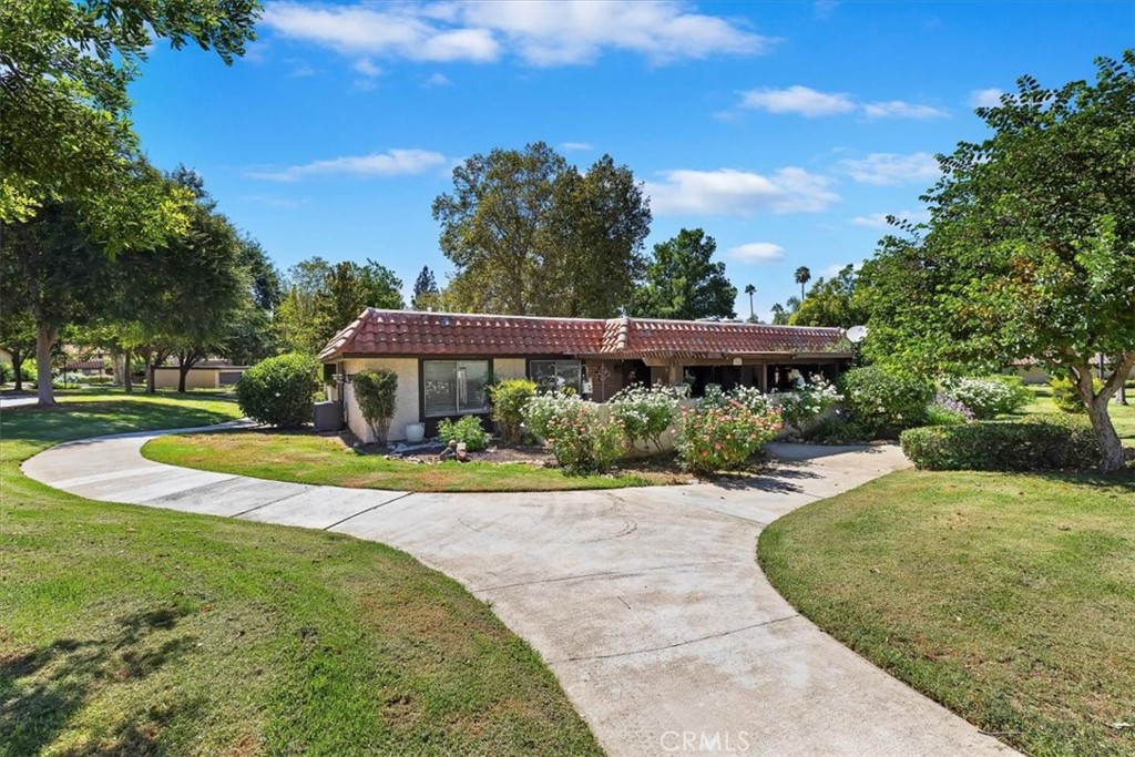 2850 Monroe Street Riverside, CA 92504 - Photo 22 of 23 view of a house with yard and a garden