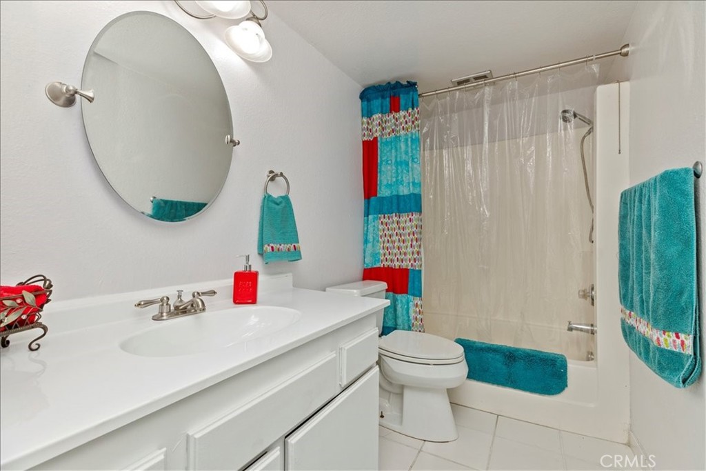 2850 Monroe Street Riverside, CA 92504 - Photo 6 of 23 a bathroom with a sink toilet and shower