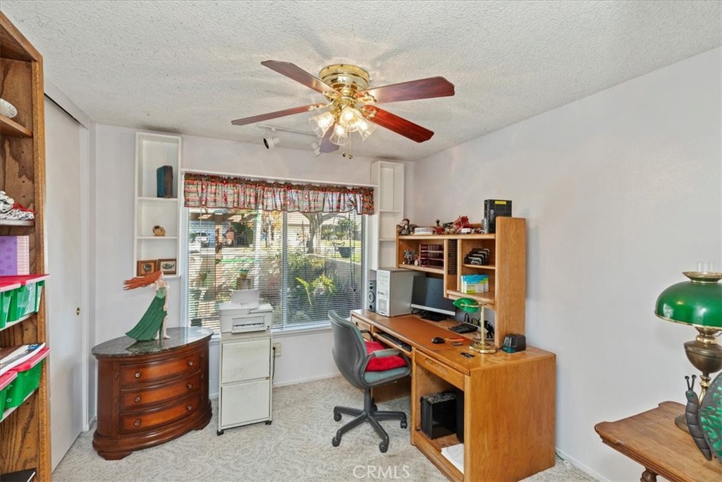 2850 Monroe Street Riverside, CA 92504 - Photo 8 of 23 a view of a workspace with furniture and a window