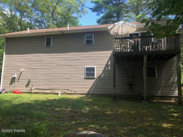 113 Beecher Road Dingmans Ferry, PA 18328 - Photo 3 of 24 a view of a house with a yard