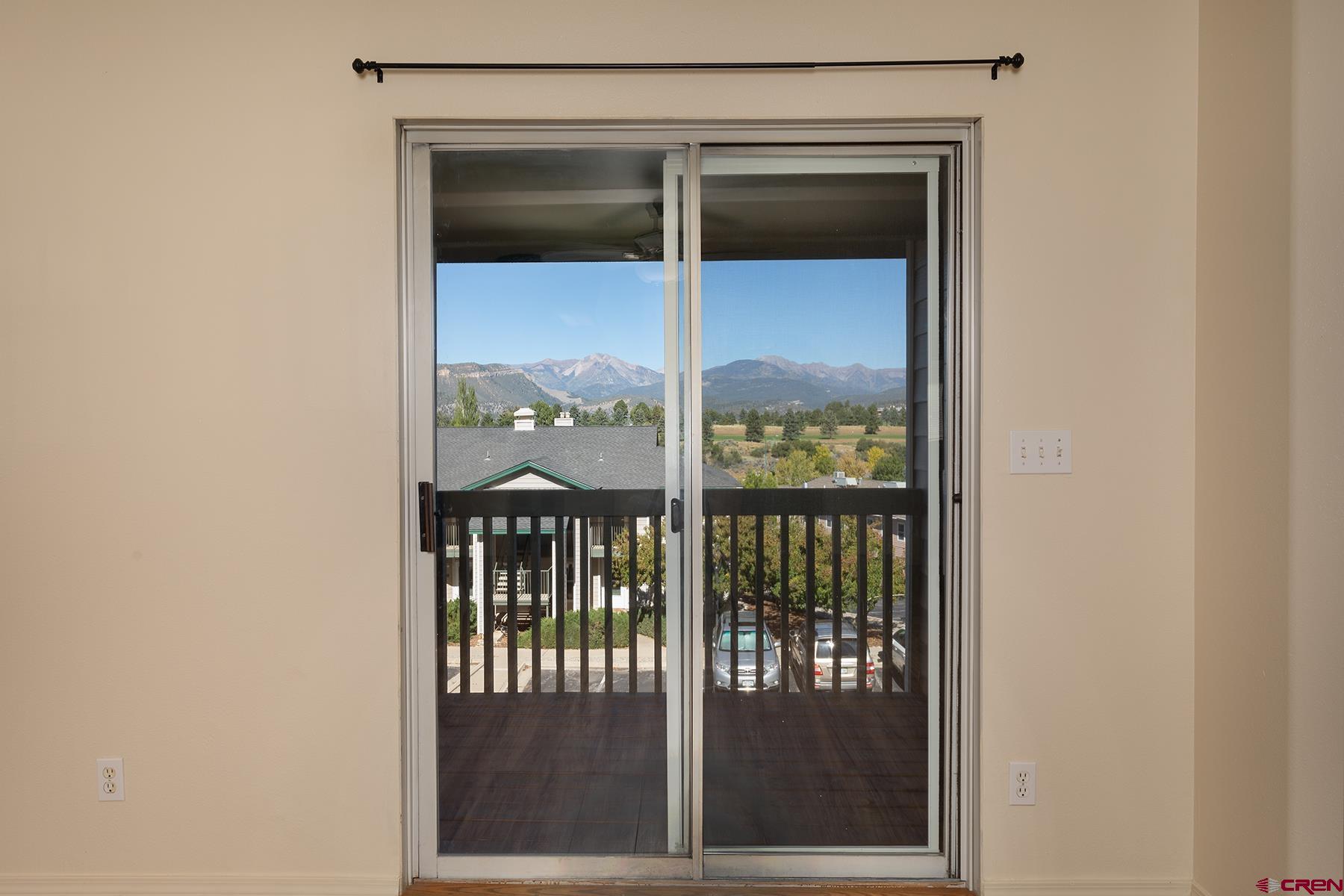 1100 Goeglein Gulch Road, Unit 236 Durango, CO 81301 - Photo 13 of 23 a view of a glass door of the house