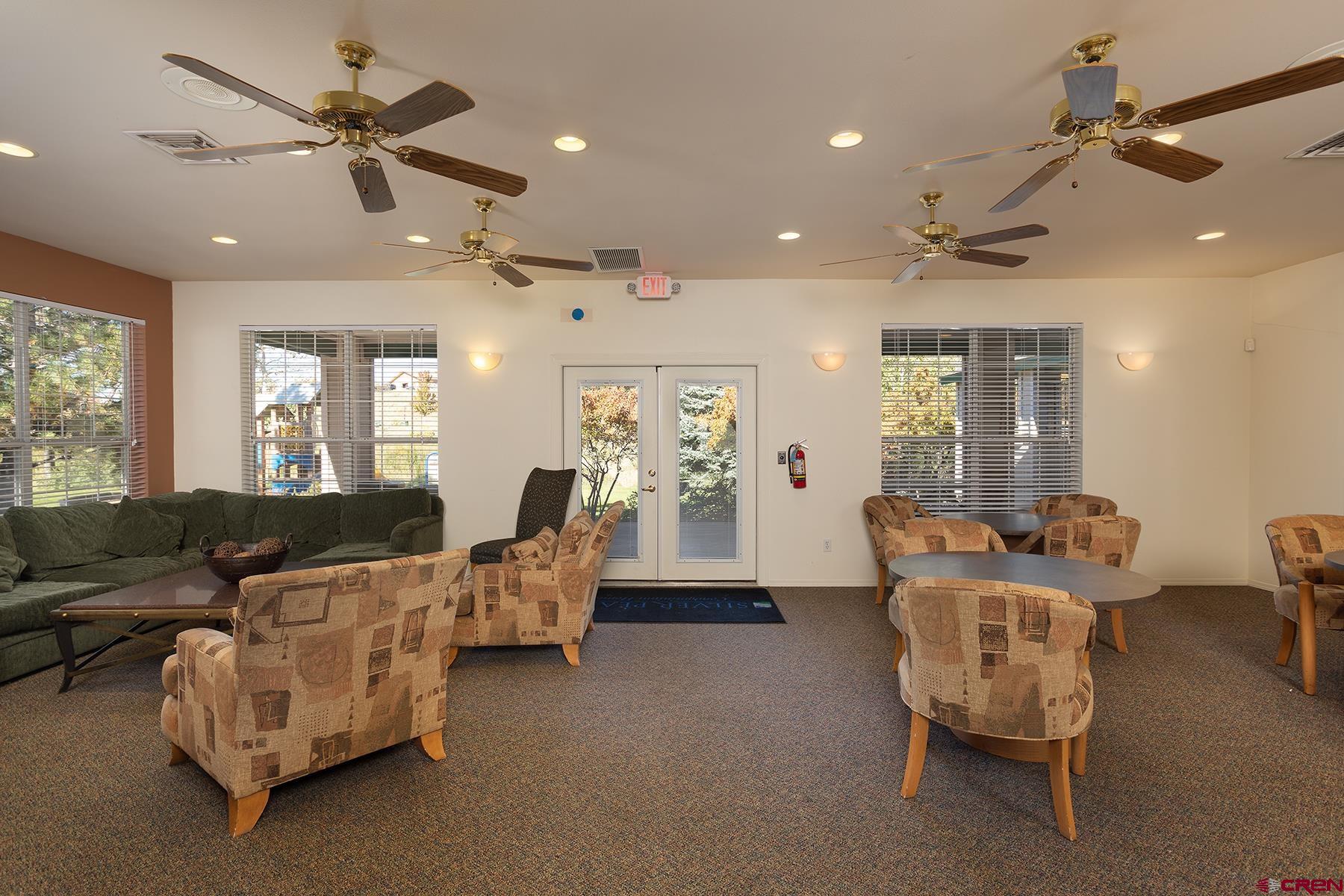 1100 Goeglein Gulch Road, Unit 236 Durango, CO 81301 - Photo 18 of 23 a living room with furniture and a chandelier