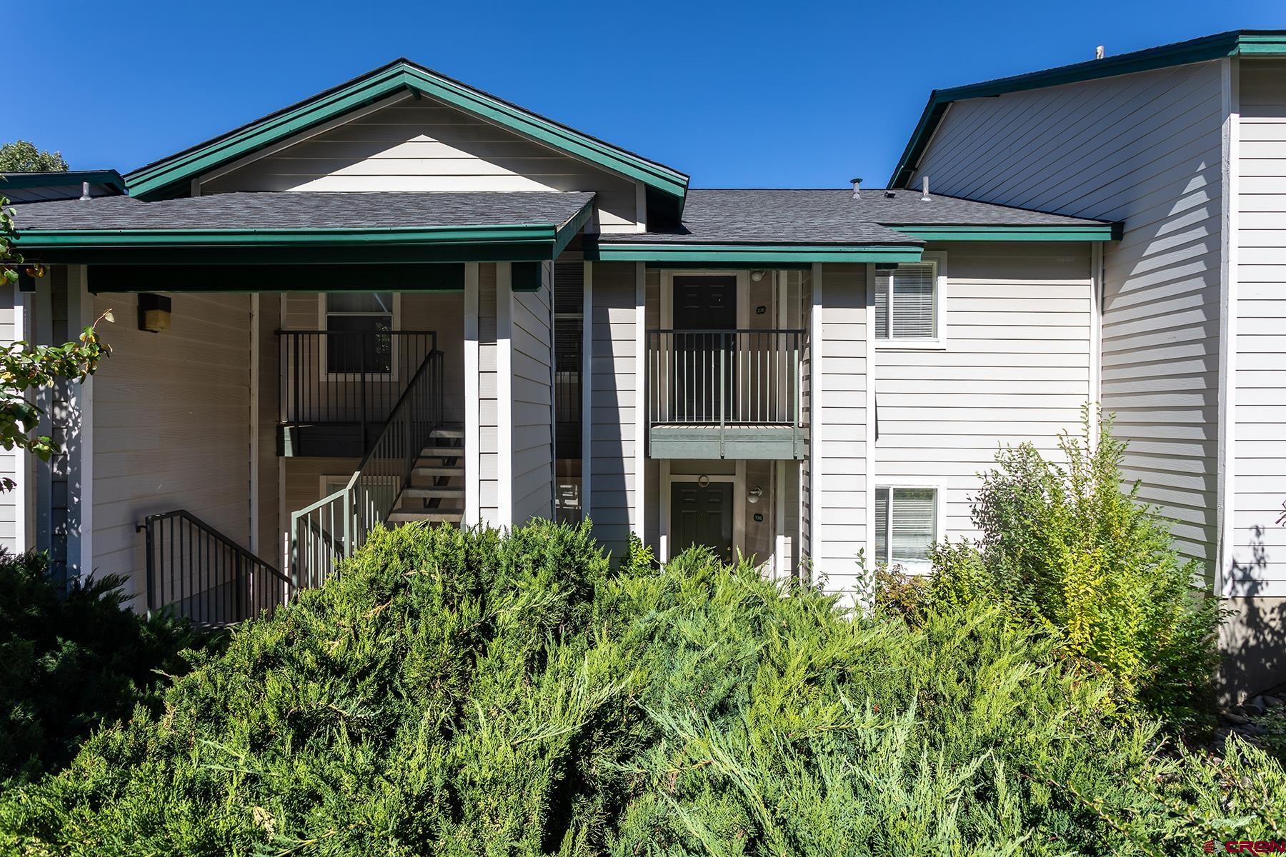 1100 Goeglein Gulch Road, Unit 236 Durango, CO 81301 - Photo 2 of 23 a front view of a house with garden