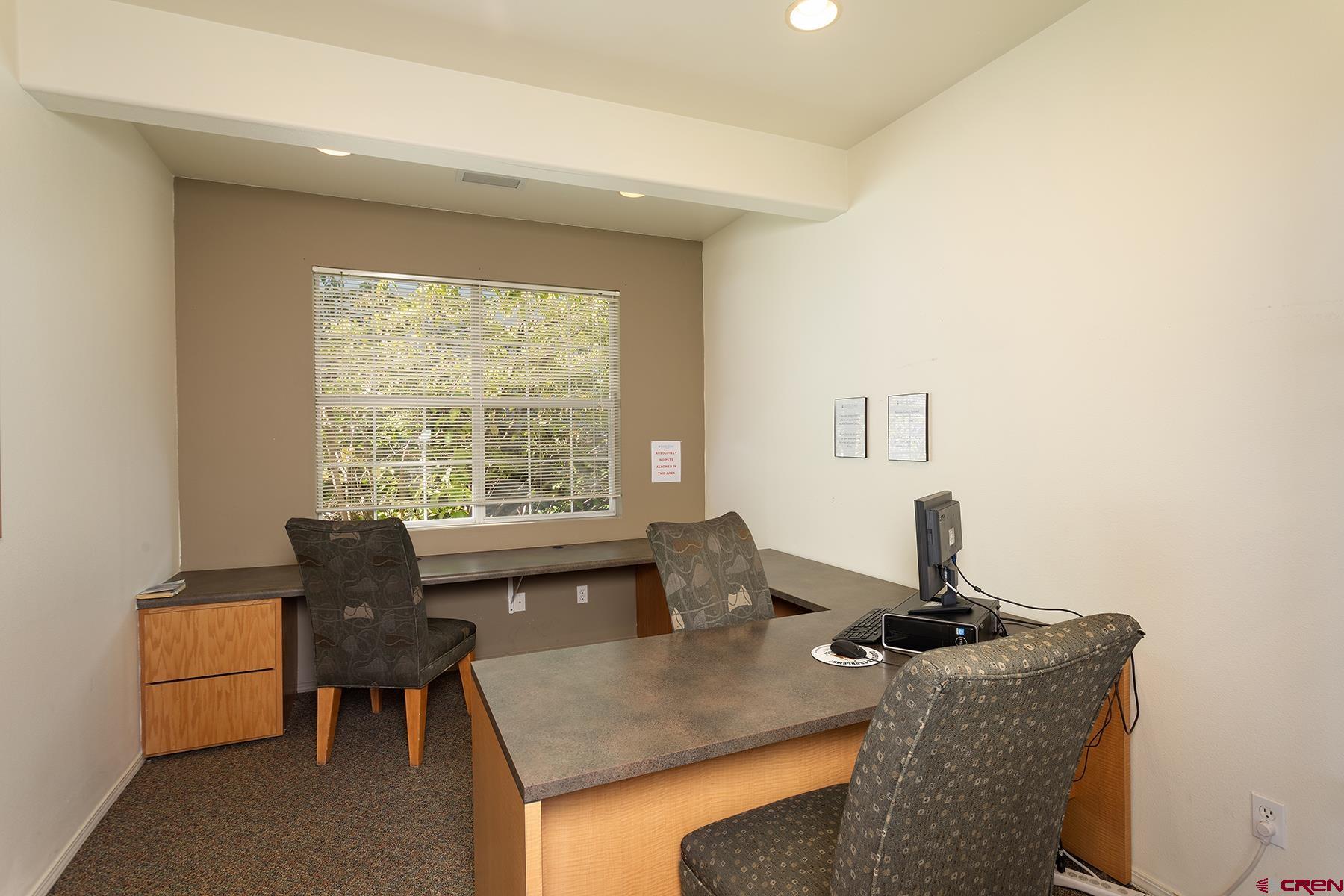 1100 Goeglein Gulch Road, Unit 236 Durango, CO 81301 - Photo 21 of 23 a dining room with furniture and window