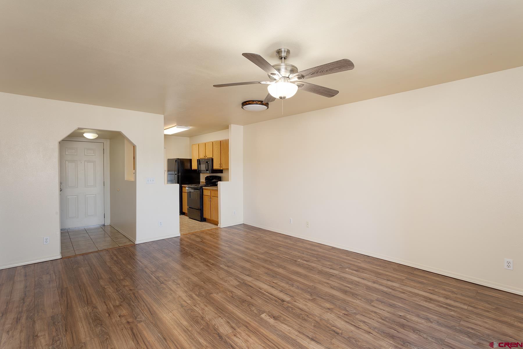 1100 Goeglein Gulch Road, Unit 236 Durango, CO 81301 - Photo 6 of 23 a view of a kitchen with a dishwasher and wooden floor