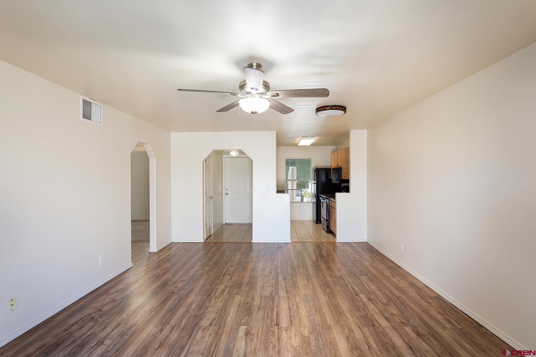 1100 Goeglein Gulch Road, Unit 236 Durango, CO 81301 - Photo 7 of 23 a view of a big room with wooden floor and a chandelier fan