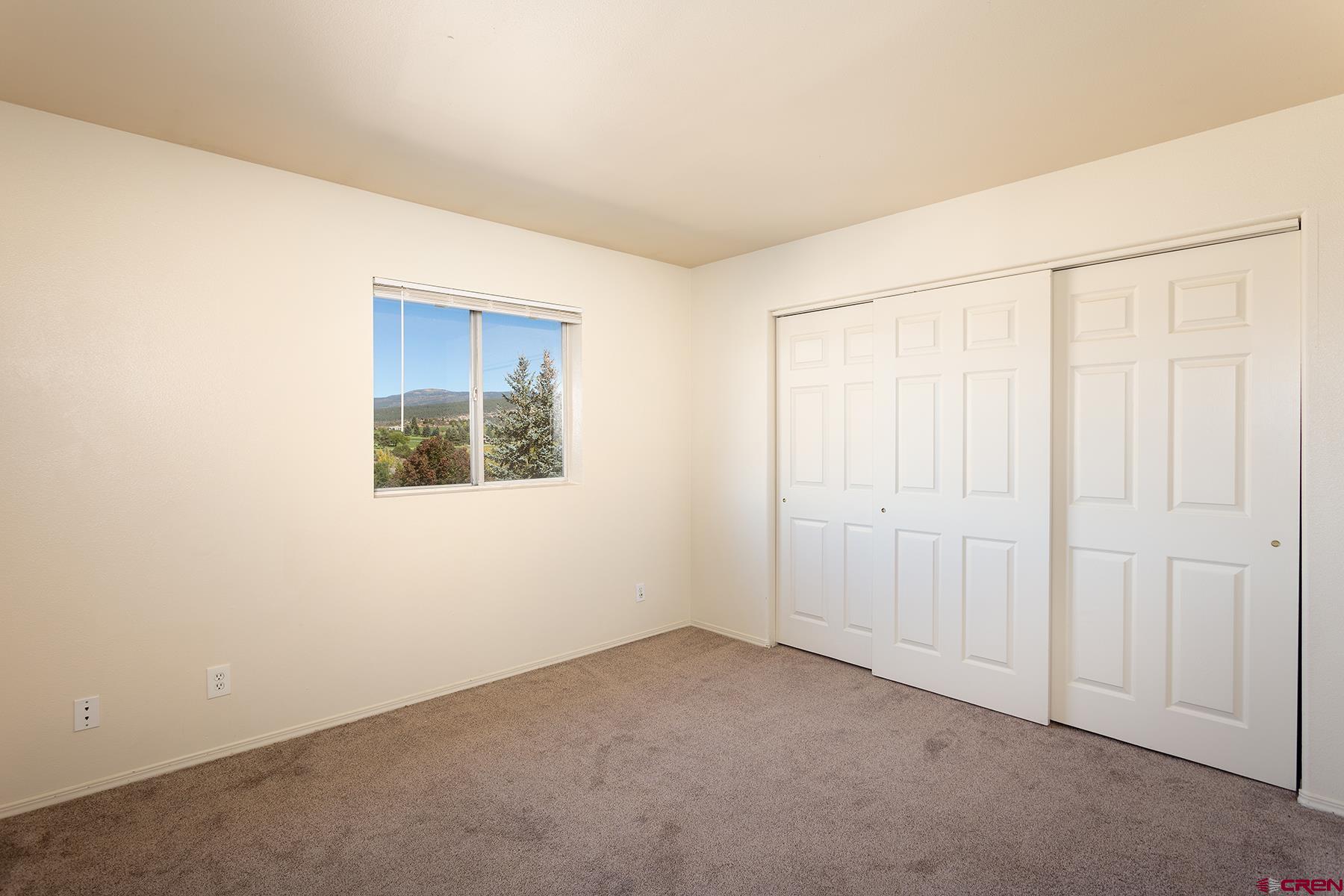 1100 Goeglein Gulch Road, Unit 236 Durango, CO 81301 - Photo 8 of 23 an empty room with a window