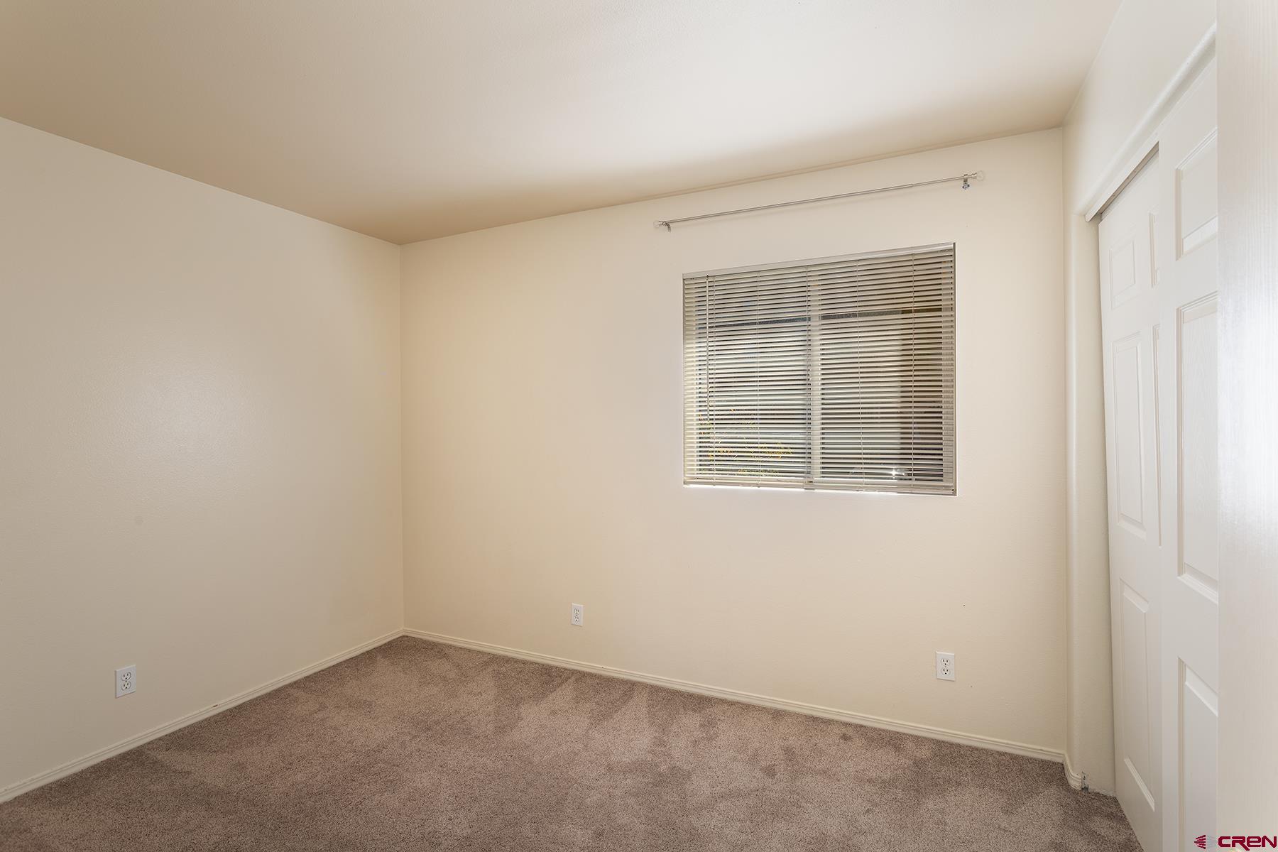 1100 Goeglein Gulch Road, Unit 236 Durango, CO 81301 - Photo 10 of 23 an empty room with a window