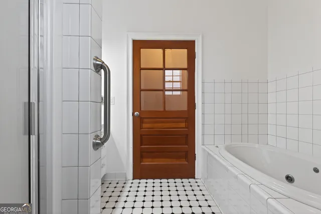 a view of a kitchen with a sink stainless steel appliances and cabinets