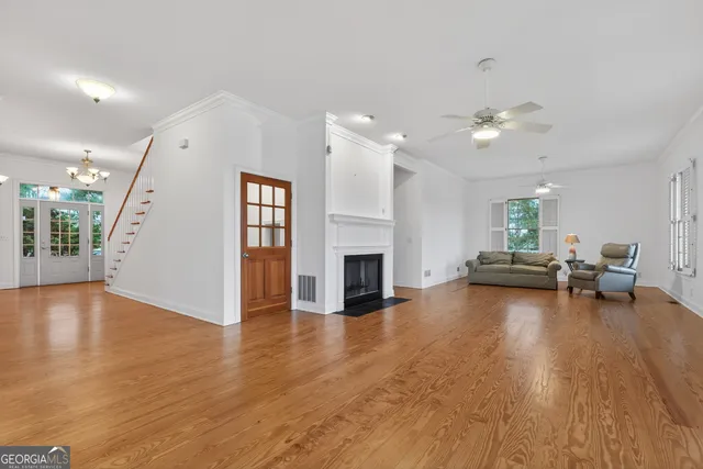 a view of a kitchen center island cabinets and wooden floor