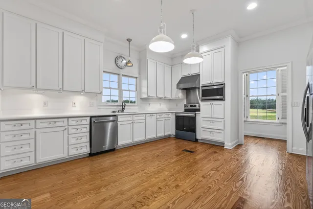 a view of a sink and a window