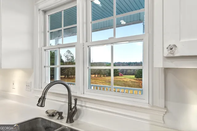a kitchen with a sink a stove and refrigerator