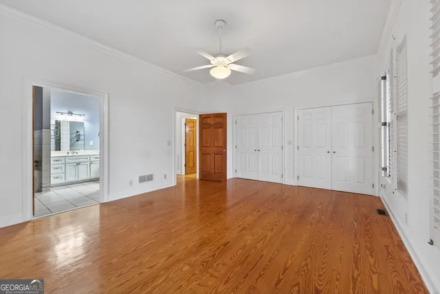 a bathroom with a toilet a sink and a window