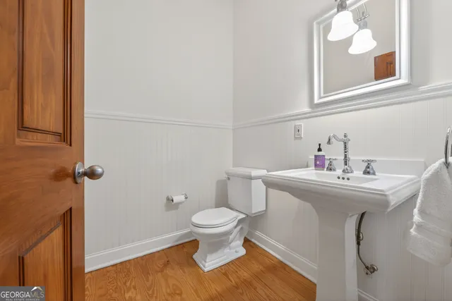a view of an empty room and wooden floor