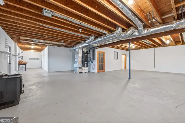 a front view of a house with swimming pool and outdoor seating