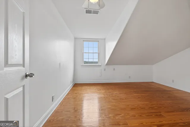 a view of a balcony with wooden floor