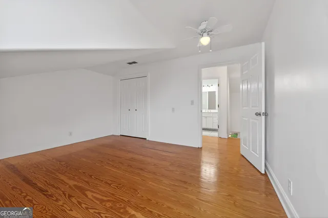 a view of a city with large trees