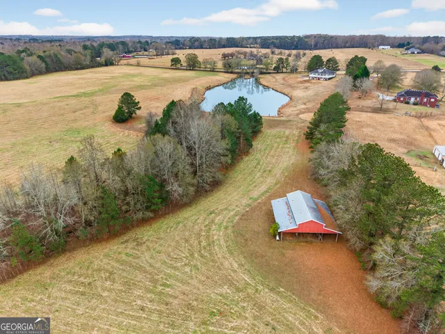 a house with swimming pool in front of it