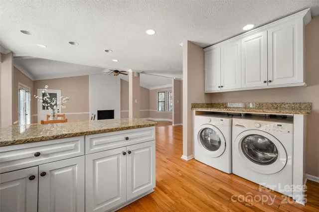 a view of a kitchen with sink and cabinets