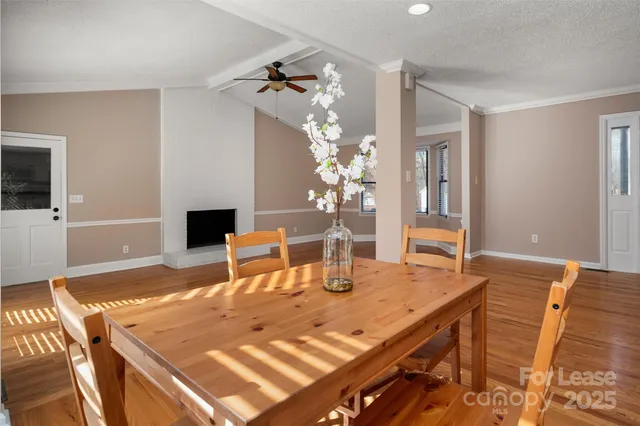 a dining room with a table and chairs