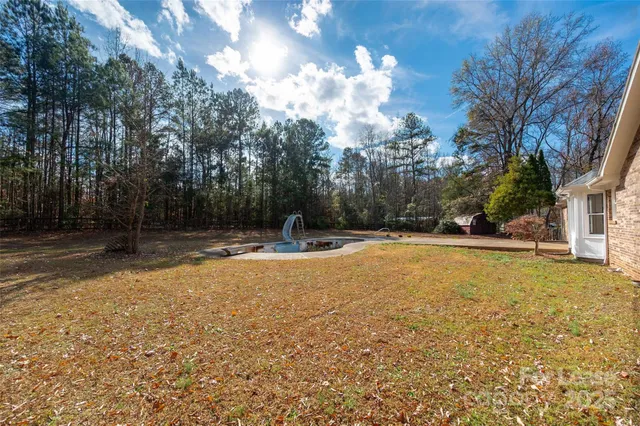 a view of swimming pool with an trees
