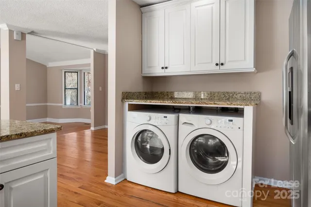 a view of a kitchen cabinets and wooden floor