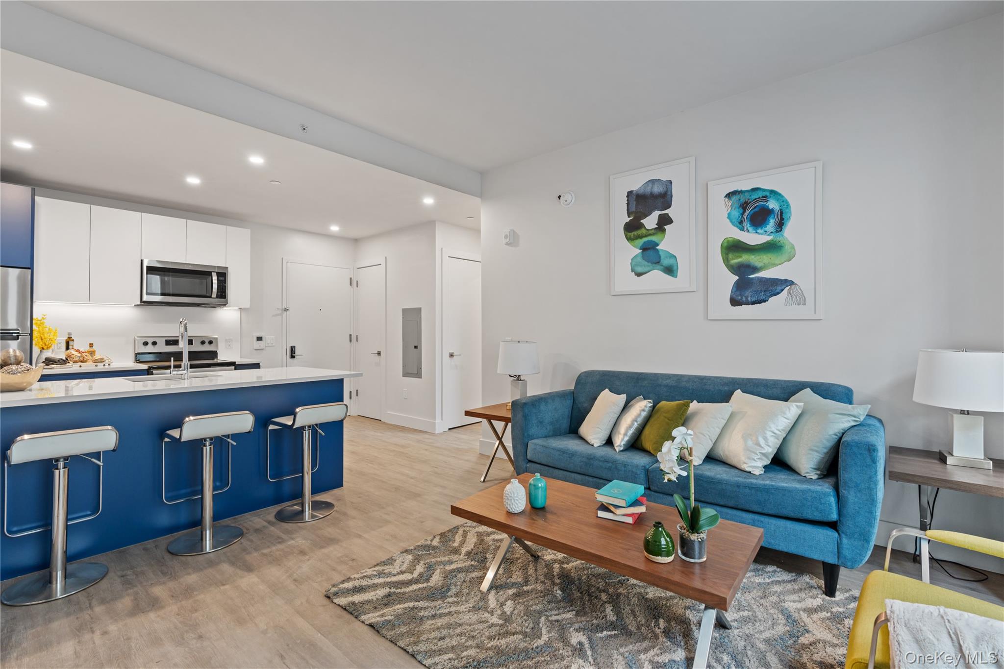 40 Westchester Place, Unit 510 New Rochelle, NY 10801 - Photo 4 of 10 a living room with furniture and kitchen view