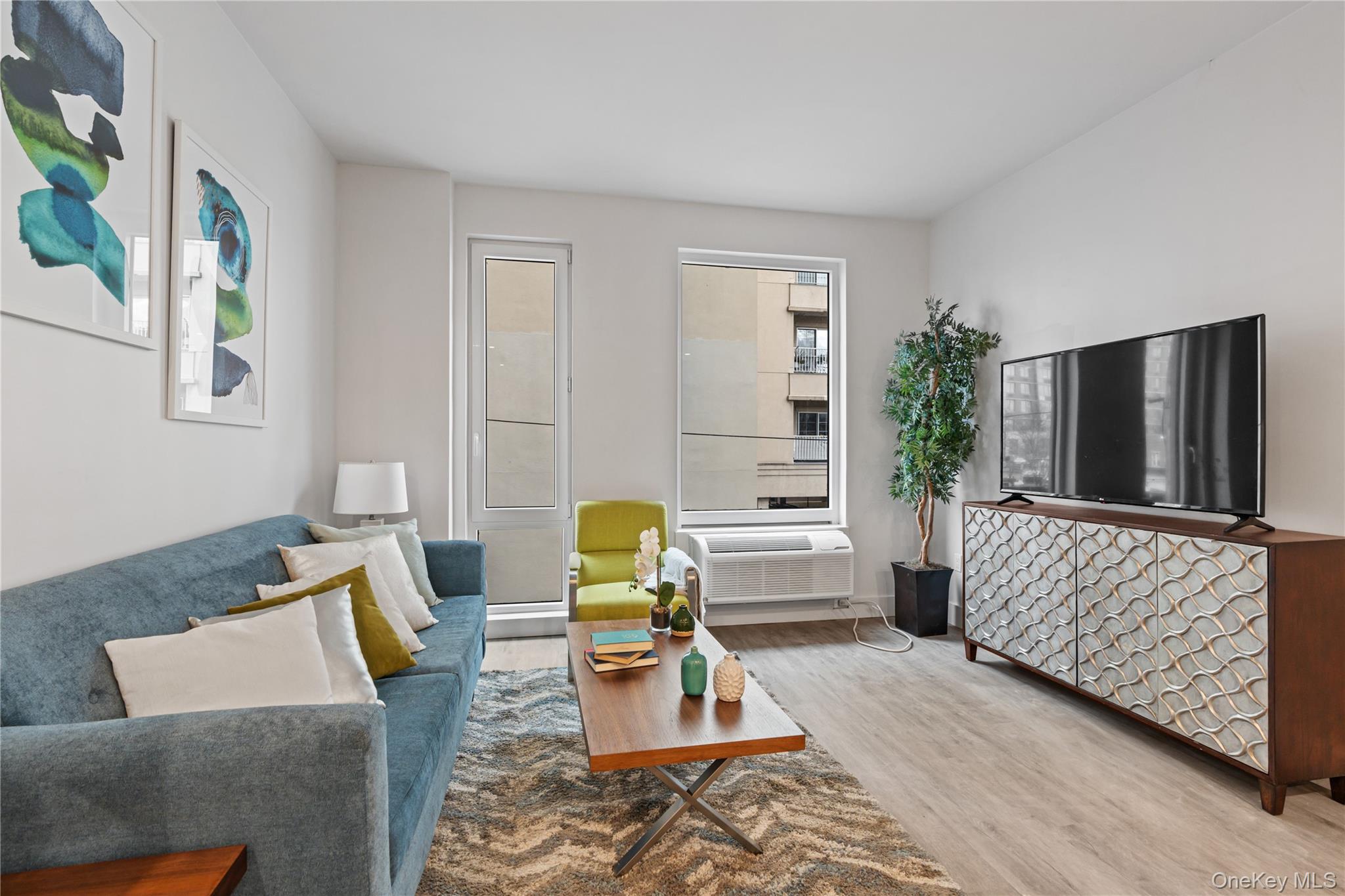 40 Westchester Place, Unit 510 New Rochelle, NY 10801 - Photo 7 of 10 a living room with furniture and a window